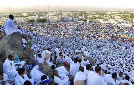 Muslim pilgrims head to pray on a rocky hill called the Mountain of Mercy, on the Plain of Arafat near Mecca, Saudi Arabia, Friday, Nov. 4, 2011. The annual Islamic pilgrimage draws 2.5 million visitors each year, making it the largest yearly gathering of people in the world. (AP Photo/Hassan Ammar)